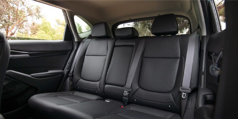 backseats with black upholstery of a 2024 kia seltos