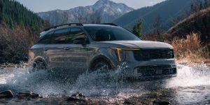 left hand angle of a gray 2024 Kia Sorento driving through a river | Lanham, MD