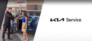 lady shaking hands with her Kia Service technician | Lanham, MD