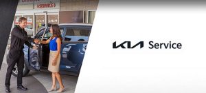 lady shaking hands with her Kia Service technician | Lanham, MD