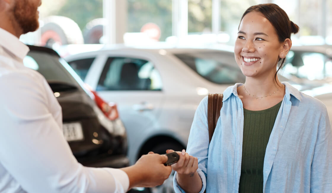 Woman being handed keys