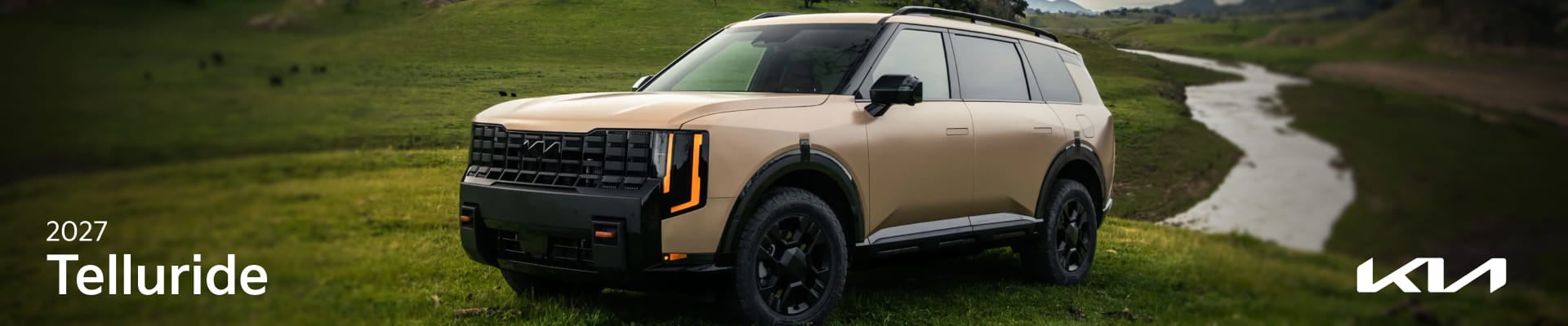 2027 Kia Telluride parked on a grassy landscape beside a winding stream.